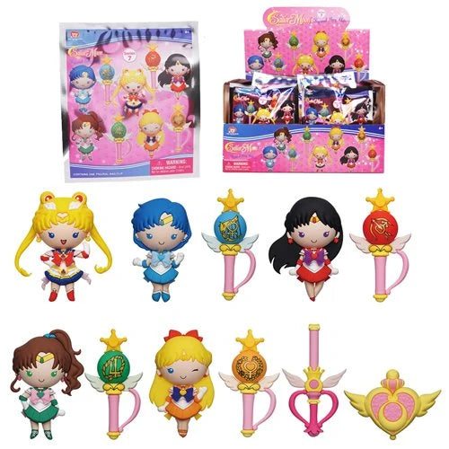 Collection of Sailor Moon-themed figurines and packaging on a white background