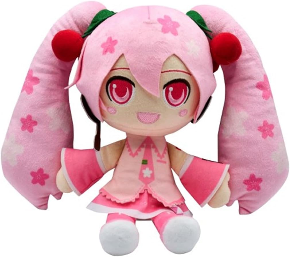 A pink anime-style plush doll with long twin-tail pigtails, large red eyes, and a pink outfit with white stars, shown on a plain white background.