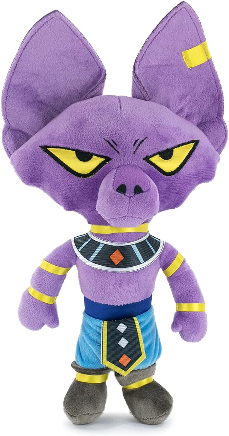 A purple cartoon animal plush toy with large pointed ears, yellow eyes, and a blue-and-yellow outfit, shown against a plain white background.