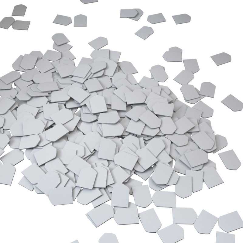 Gray square tiles scattered on a white background