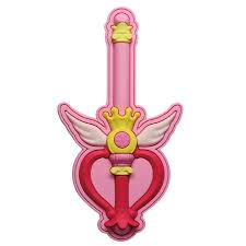 Heart-shaped object with wings and crowns on a pink background