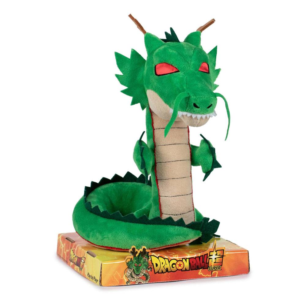 Green plush dragon toy with red eyes on a white background