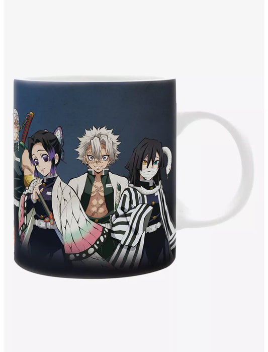 A ceramic mug featuring anime characters from Demon Slayer, printed on a dark navy background, shown against a plain white studio background.