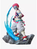 A collectible anime figurine of a character with spiky pink hair, striped blue and white face paint, and a pink-and-white outfit, posed on a rocky base with a large translucent blue energy effect behind him.