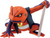 A collectible action figure of a red and purple frog character holding a white scroll, set against a plain white background.