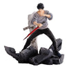 Figurine of a character in a dynamic pose with a sword on a white background