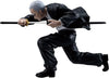 A collectible action figure of the anime character Katakuri from The Seven Deadly Sins, depicted in a crouching, sword-ready pose. He has gray hair and wears a black jacket and pants over a white shirt, holding a katana with a gold hilt.