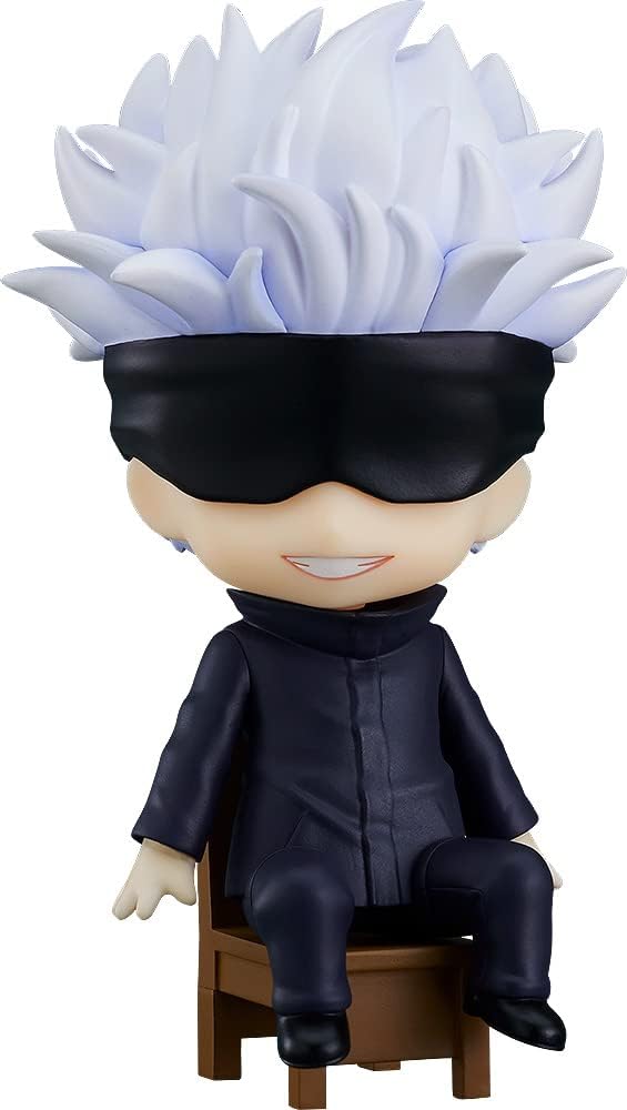 Action figure with spiky white hair and black mask sitting on a stool against a white background