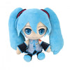Plush toy with blue hair and outfit on a white background