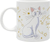 A white ceramic mug featuring an illustration of a white cat with pink inner ears, surrounded by gold stars, sparkles, and cursive text on a plain white background.