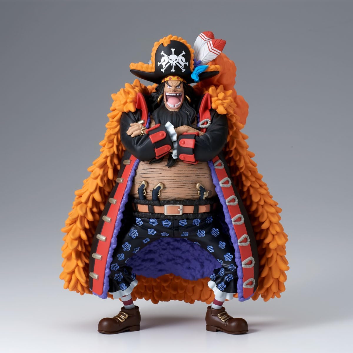 Action figure with a character in an orange coat and black outfit on a gray background