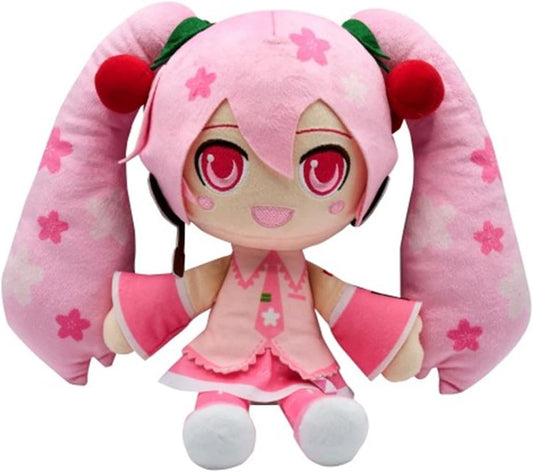 A pink anime-style plush doll with long twin-tail pigtails, large red eyes, and a pink outfit with white stars, shown on a plain white background.