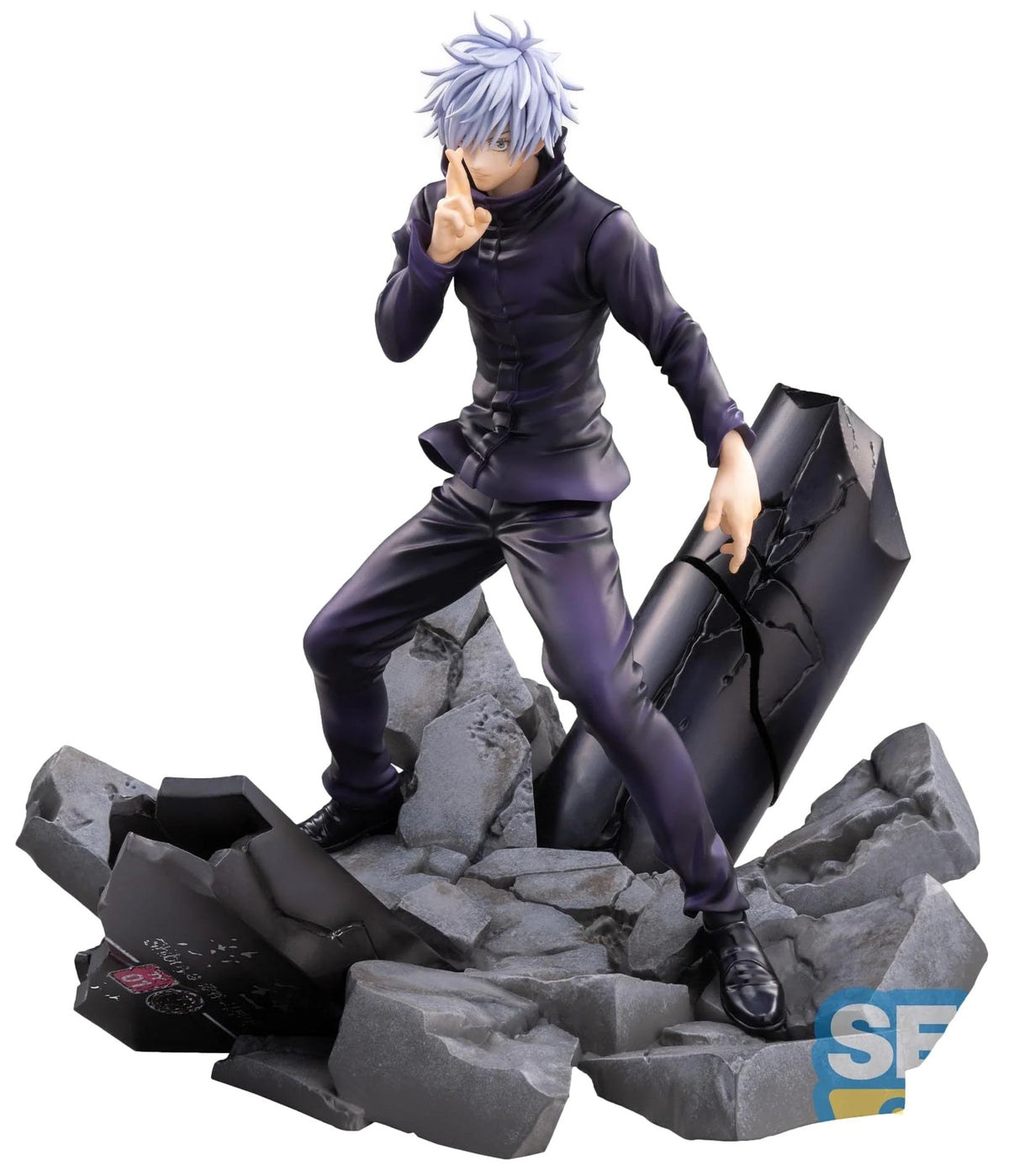 A collectible anime figurine of Satoru Gojo from Jujutsu Kaisen, posed dynamically on a cracked black cylindrical object atop a gray rocky base, set against a plain white background.