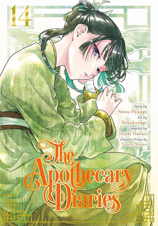 Front cover of The Apothecary Diaries Volume 14 manga book, featuring an illustrated young man in a green robe with dark hair, with the title in large orange lettering and a light green patterned background.