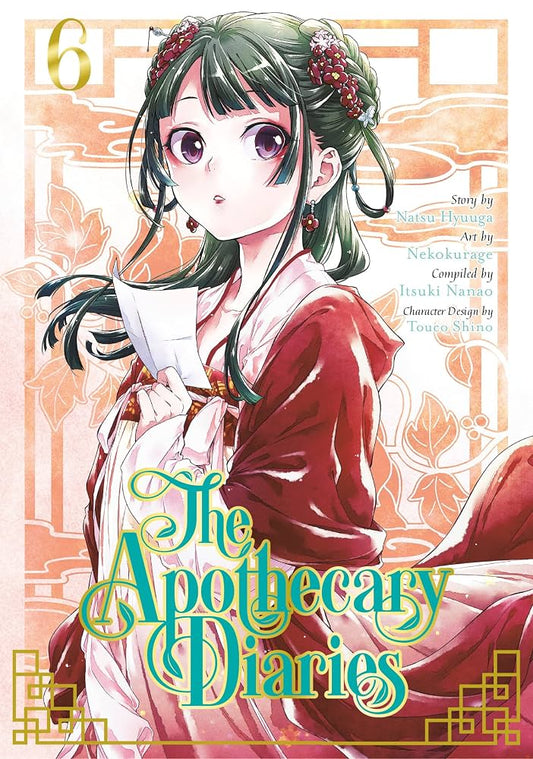 Front cover of the manga volume 6 of The Apothecary Diaries, featuring a detailed illustration of a female apothecary with green hair and purple eyes, wearing a red and white kimono, set against a peach-colored background with traditional Japanese window designs.