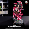 Nezuko Kamado figurine from Demon Slayer on a dark background with 'tsume' branding.
