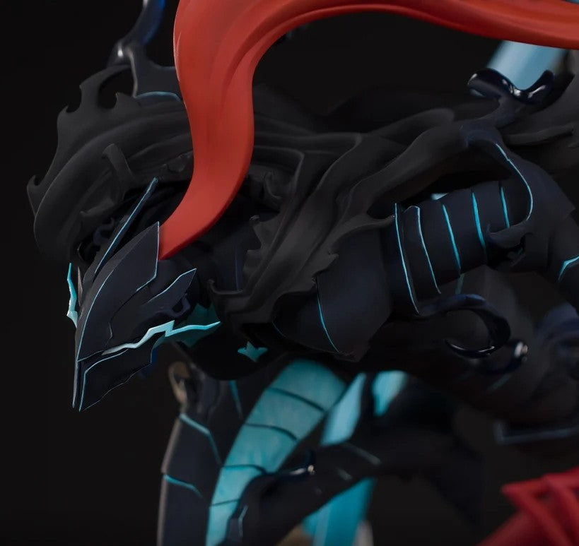 Close-up of a dark fantasy mecha or armored character figure with a flowing red cape, black armor plating, and glowing cyan accents against a black background.