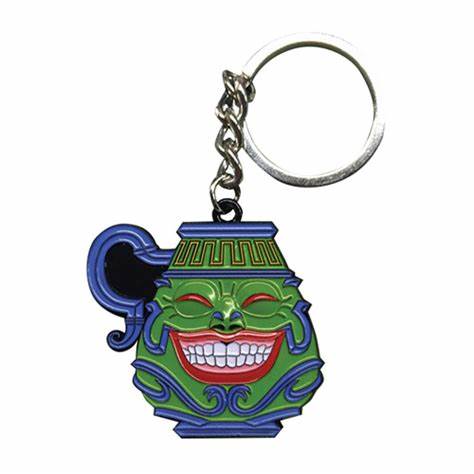 Limited edition metal keychain featuring Pot of Greed card design from Yu-Gi-Oh!, with intricate engraving and polished finish.