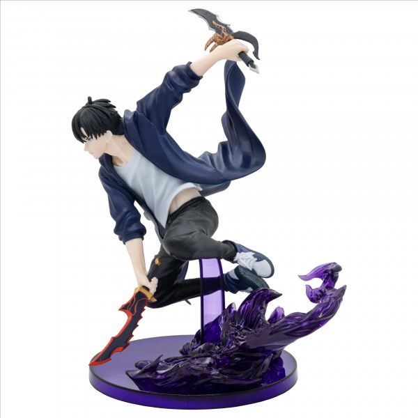Action figure of a character in dynamic pose with weapons on a white background