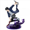 Action figure of a character in dynamic pose with weapons on a white background