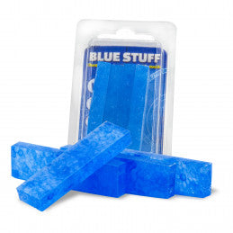 Blue blocks with packaging labeled 'Blue Stuff' on a white background