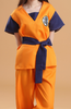 Person wearing an orange and blue outfit with a belt on a beige background