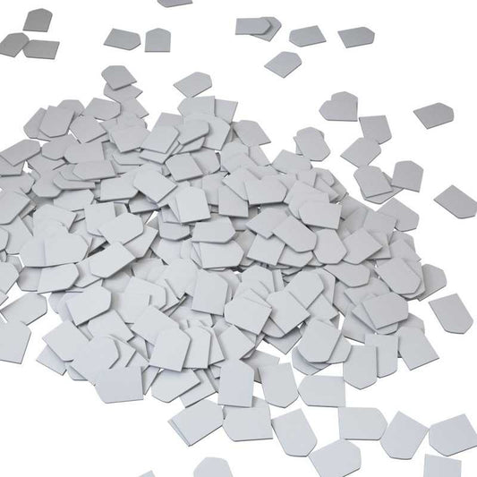 Gray square tiles scattered on a white background