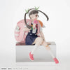 Anime character figurine with a pink backpack on a white background