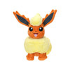 A plush toy of Eevee from Pokémon, featuring its signature orange and yellow color scheme with black-tipped ears, set against a plain white background.