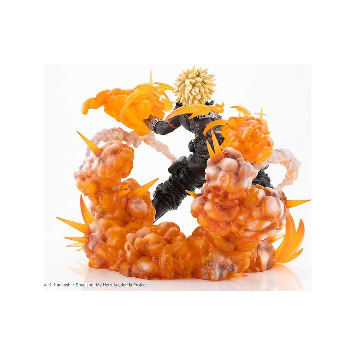 A collectible action figure of a spiky-haired character in a black outfit, posed mid-combat with translucent orange energy effects and a matching orange cloud-like base against a plain white background.