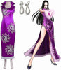 Purple dress with skull patterns, earrings, and a doll wearing the dress.