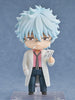 Anime character figurine with light blue hair and a white coat holding a card against a gray background
