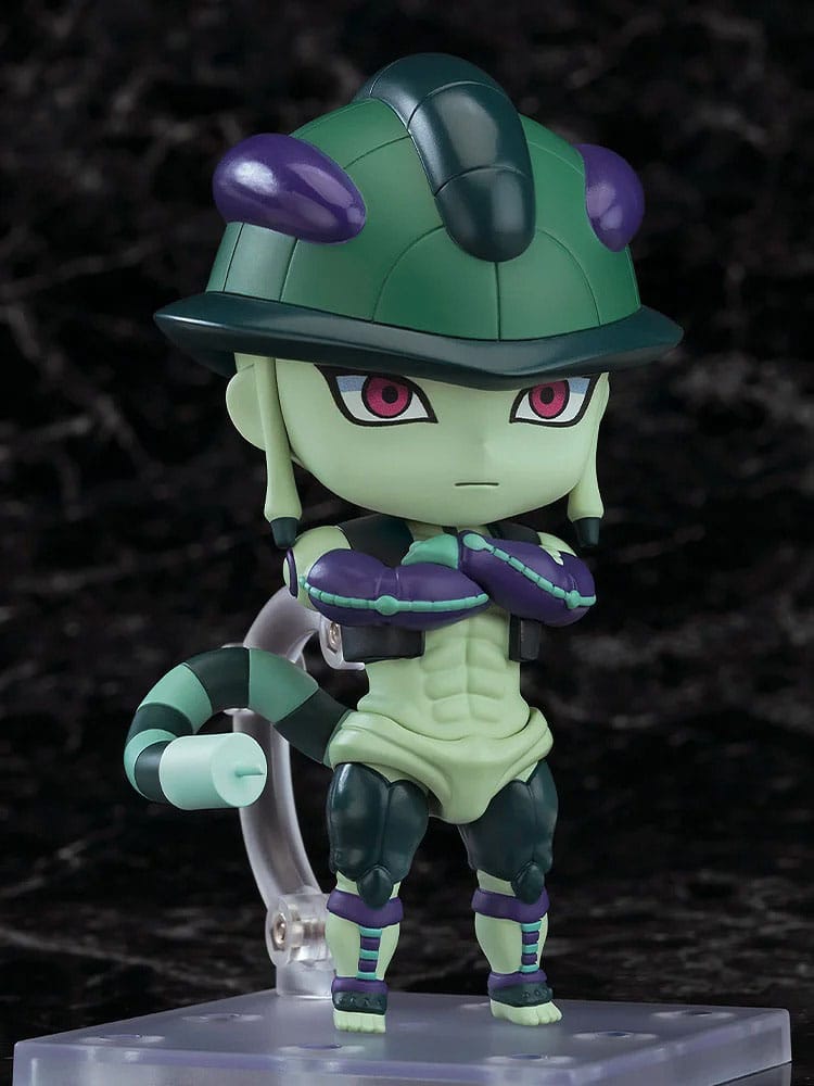 Green and purple action figure with a helmet on a black background