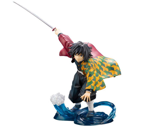 Figurine of a character with a sword, colorful outfit, and wave-like base on a white background