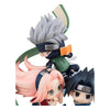 Three anime character figurines on a white background
